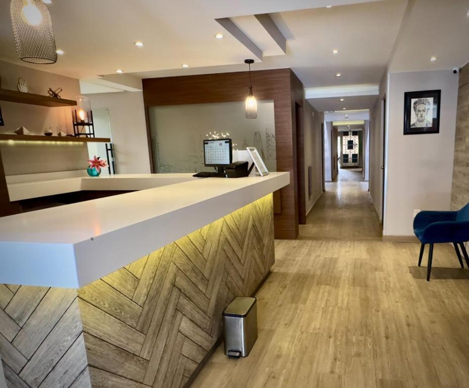 TV a/nebo společenská místnost v ubytování Hotel Monarca