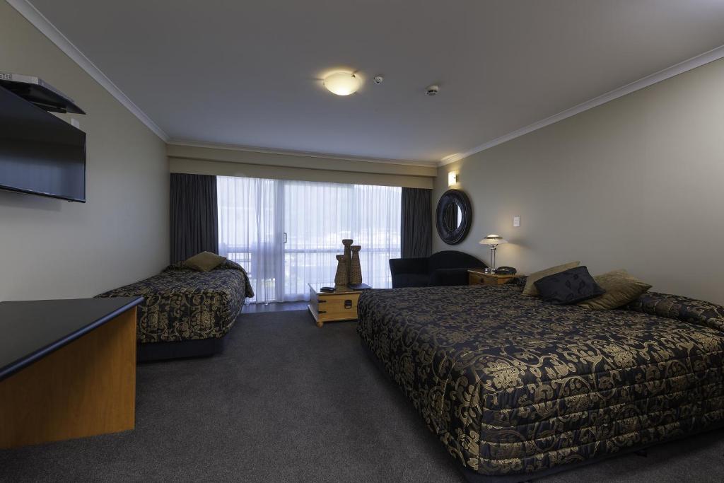 Postel nebo postele na pokoji v ubytování Beachcomber Inn Picton