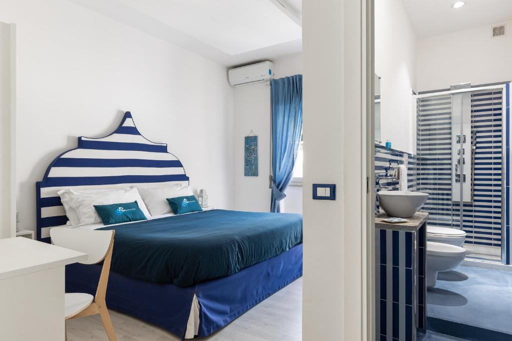 Posteľ alebo postele v izbe v ubytovaní B&B Sapore di Mare nel Blu