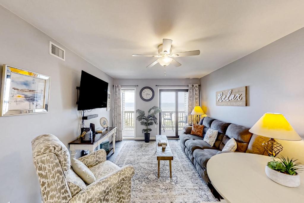 a living room with a couch and a table at Ocean Forest Villas E-308 in Myrtle Beach