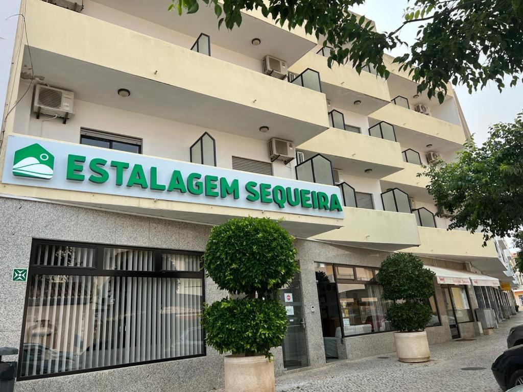 a building with a sign that reads estellezlez sevenena at Estalagem Sequeira in São Brás de Alportel