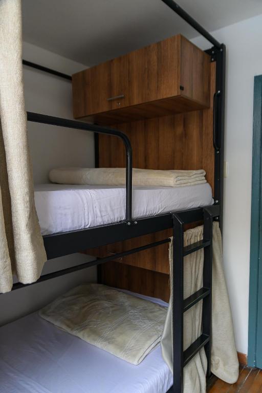 Postel nebo postele na pokoji v ubytování Trip Monkey Zona G