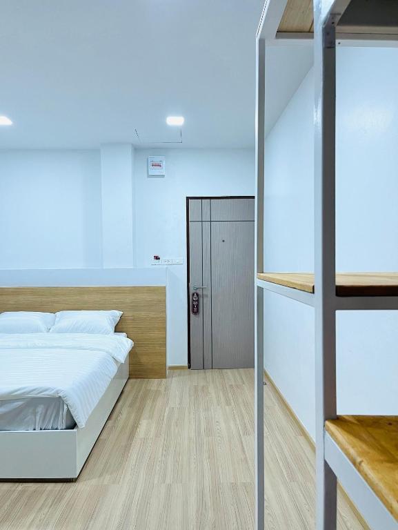 Postel nebo postele na pokoji v ubytování PD Apartment Inn