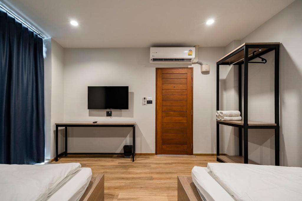 Postel nebo postele na pokoji v ubytování 19A Bangkok