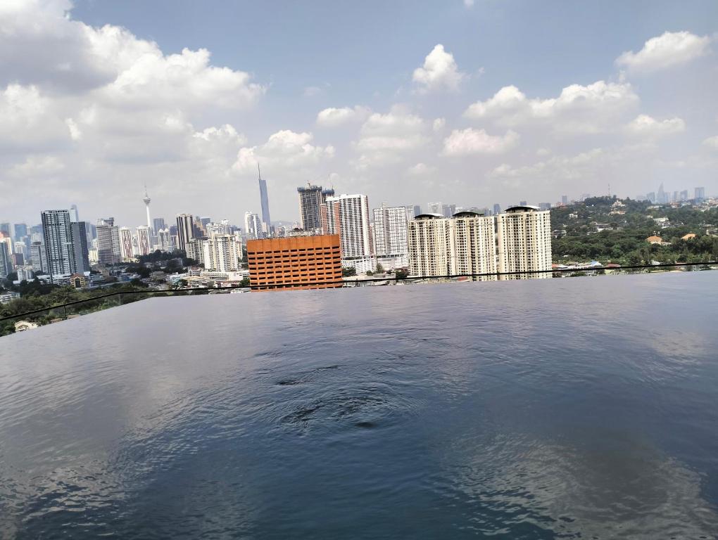a large body of water with a city in the background at The Pano Jalan Ipoh Sentul by Kenangan Homes in Kuala Lumpur