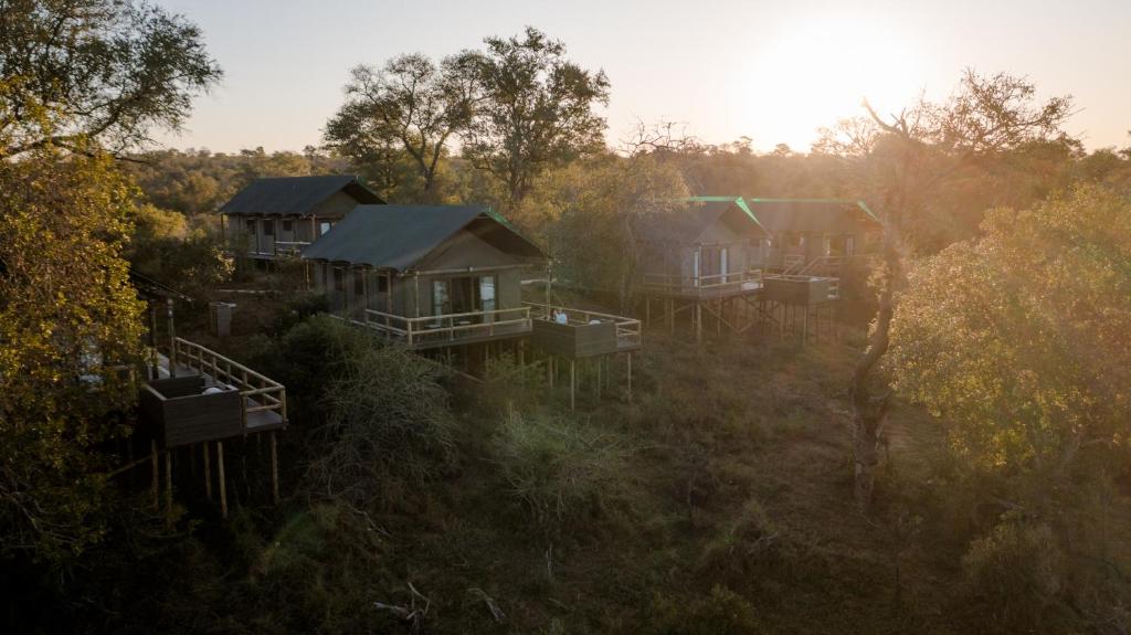 an aerial view of a group of houses in a field at Nkuhlu Tented Camp in Skukuza