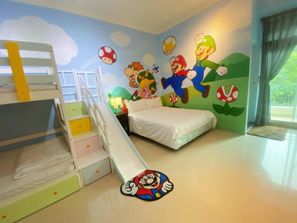 a bedroom with a bunk bed and a mural of marioauts at Hualien Lidu House in Hualien City