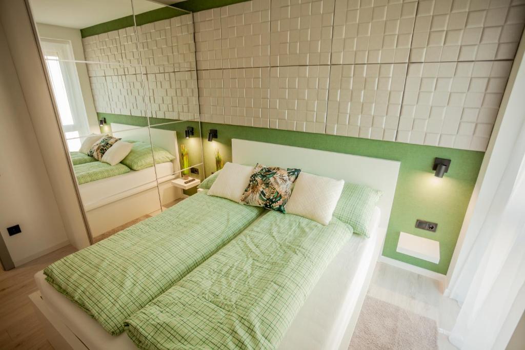 A bed or beds in a room at Central Relax Apartment