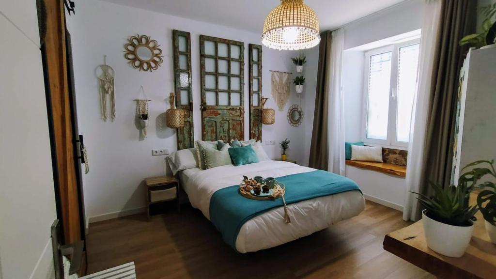 Een bed of bedden in een kamer bij El Tapial