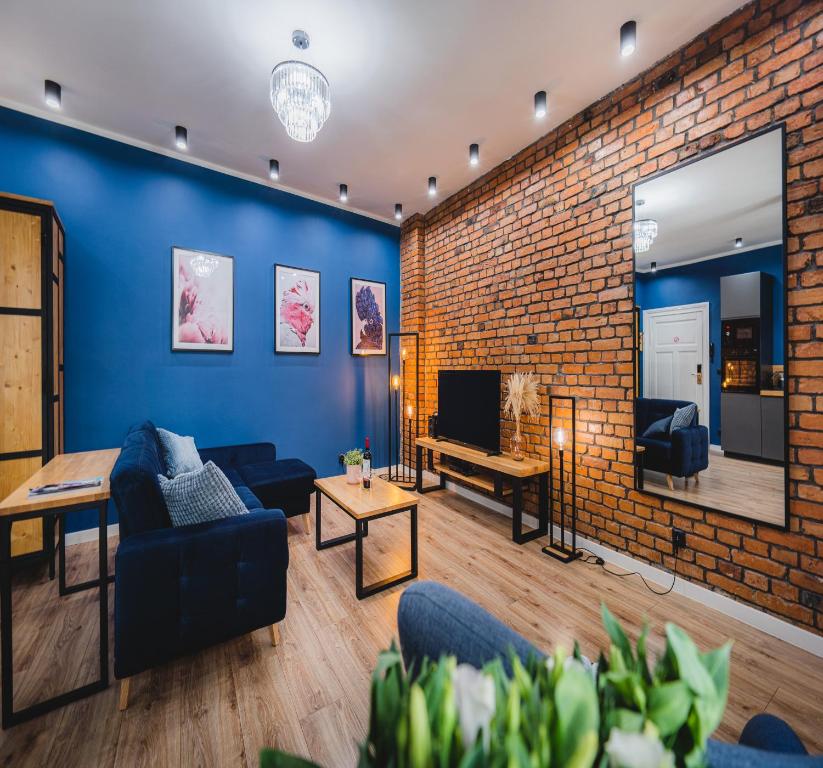 Televízia a/alebo spoločenská miestnosť v ubytovaní Modern Apartments Toruń 4 Stare Miasto-Centrum