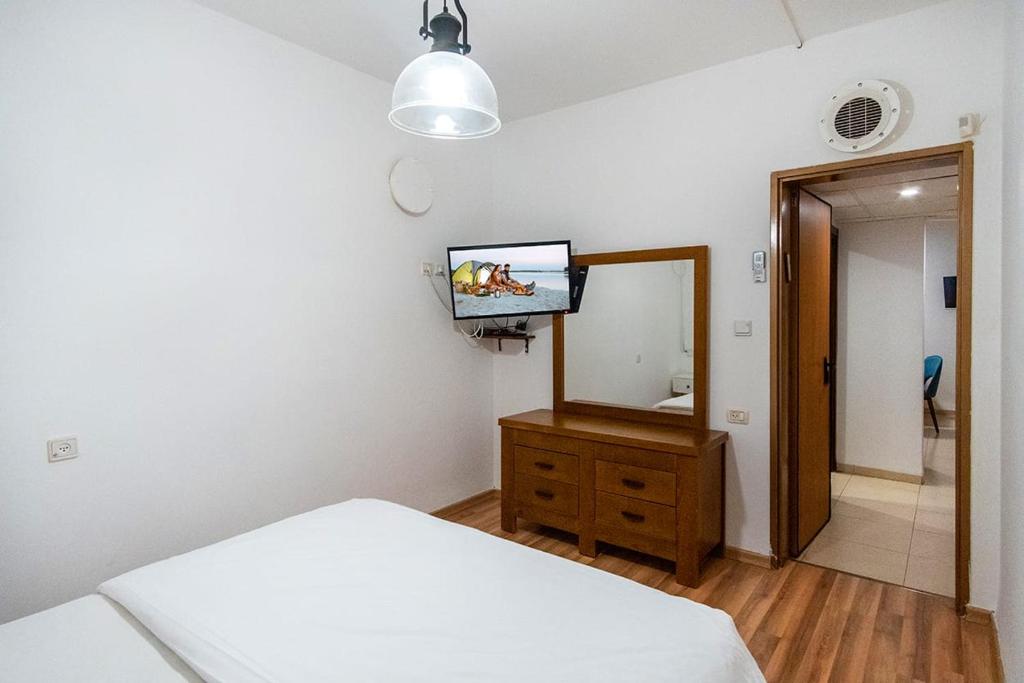 Postel nebo postele na pokoji v ubytování Nof glili Mansion