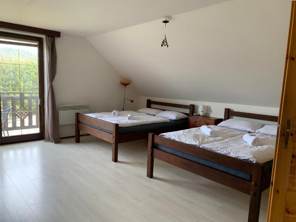 Postel nebo postele na pokoji v ubytování Ubytovani Stare Hute, Novohradské hory