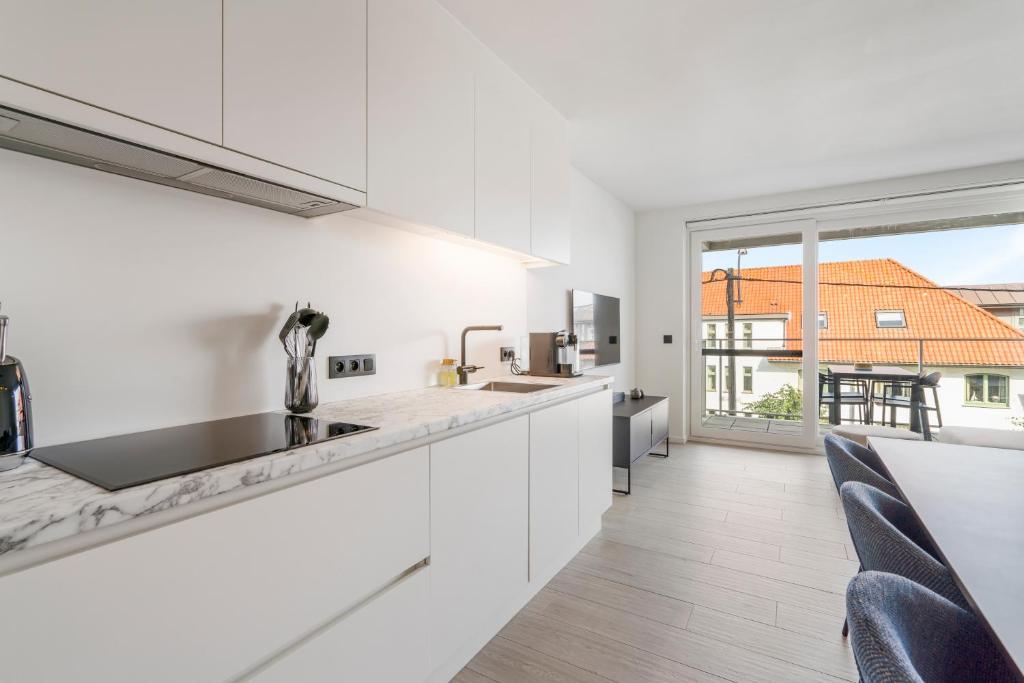 Kuchyň nebo kuchyňský kout v ubytování Maison Madison Nieuwbouw, terras, privé parking!