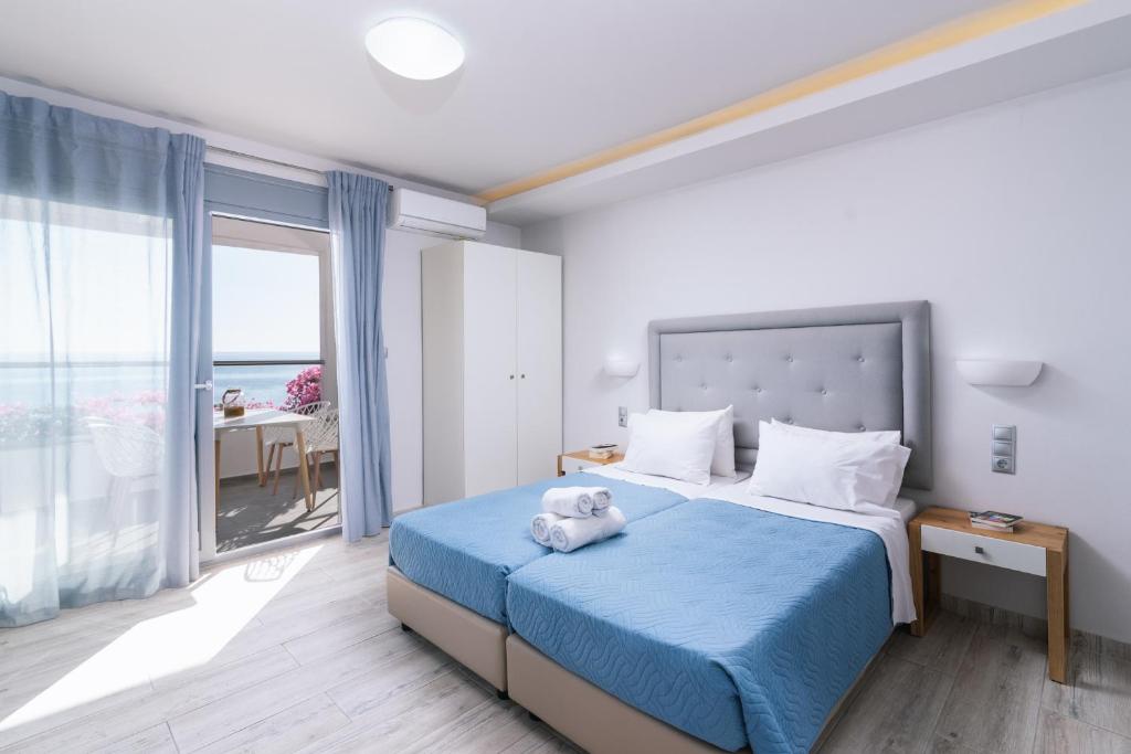 Postel nebo postele na pokoji v ubytování Zorbas Apartments-Am Strand von Lentas