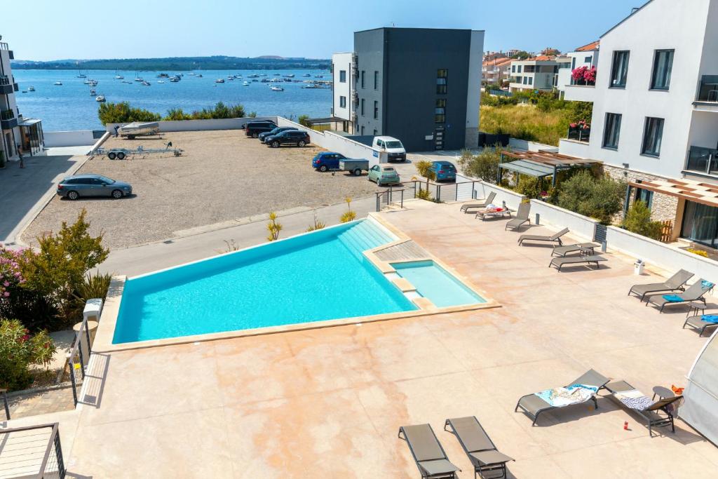 an overhead view of a swimming pool on a building at Vizula Sunset D - Antonio & Ulla & Undine in Medulin