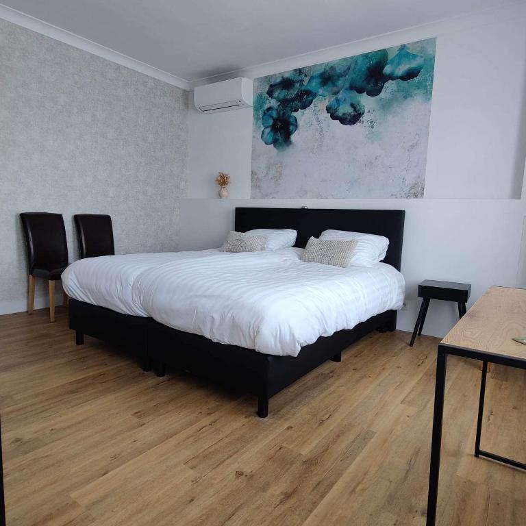 Postel nebo postele na pokoji v ubytování B&B L’Orangerie