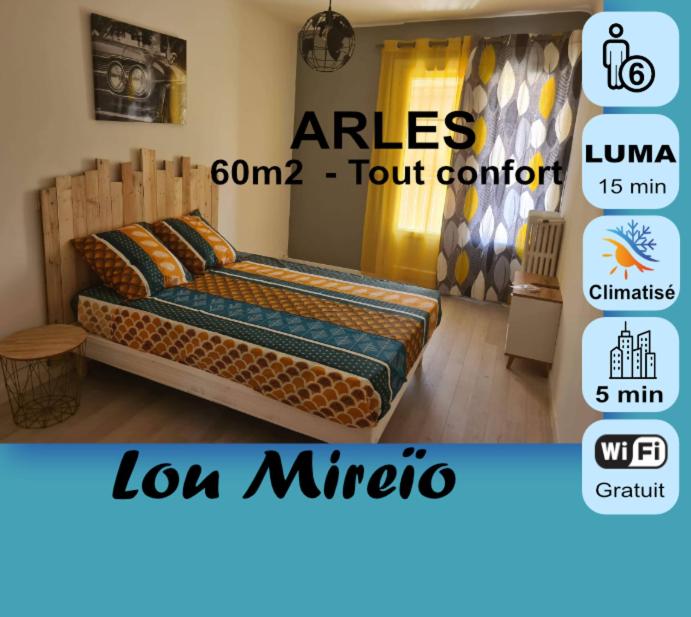 Cartel de un dormitorio con cama en una habitación en Mireio Arles centre climatisé 1 à 6 personnes Appartement, en Arles