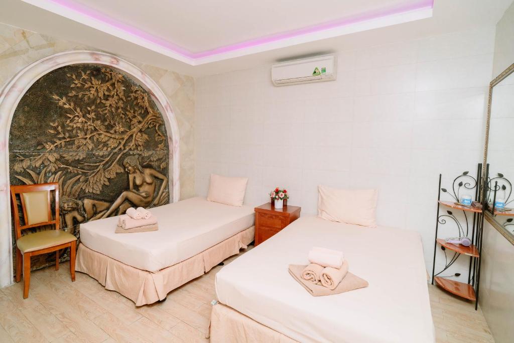 Postel nebo postele na pokoji v ubytování A25 Luxury Hotel