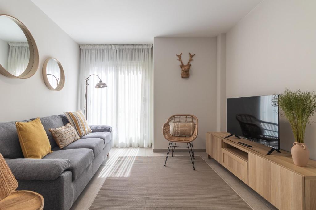 Televízia a/alebo spoločenská miestnosť v ubytovaní Apartamento Chacolina Las Canteras