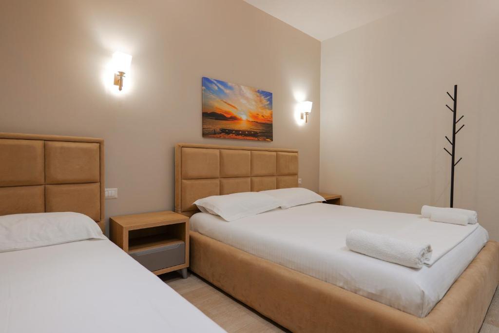 Postel nebo postele na pokoji v ubytování Hotel Roalb