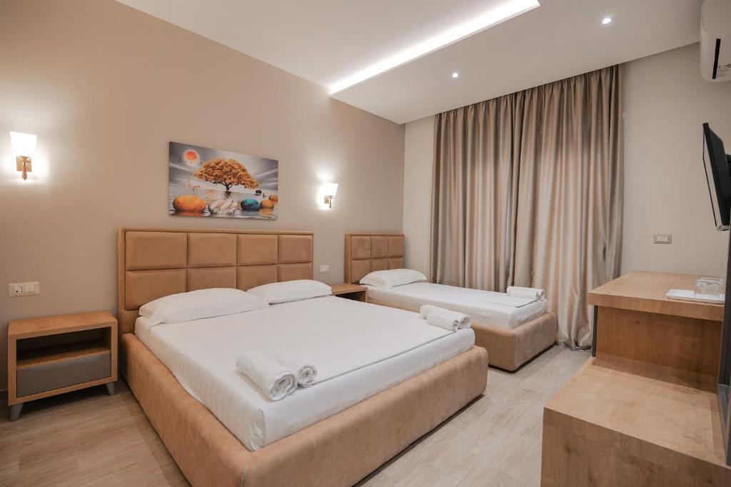 Postel nebo postele na pokoji v ubytování Hotel Roalb