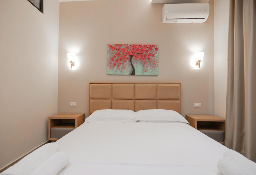 Postel nebo postele na pokoji v ubytování Hotel Roalb