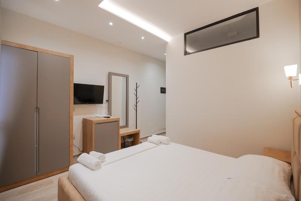 Postel nebo postele na pokoji v ubytování Hotel Roalb
