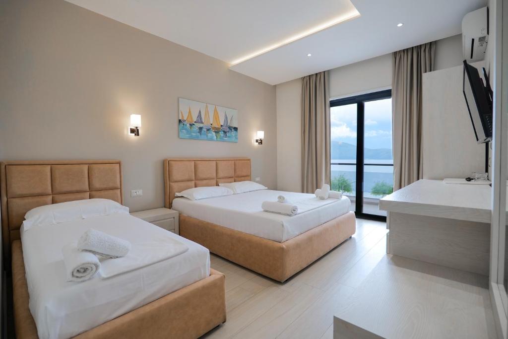 Postel nebo postele na pokoji v ubytování Hotel Roalb