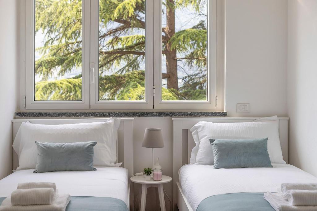 Postel nebo postele na pokoji v ubytování Appartamento con Terrazzo Vistalago