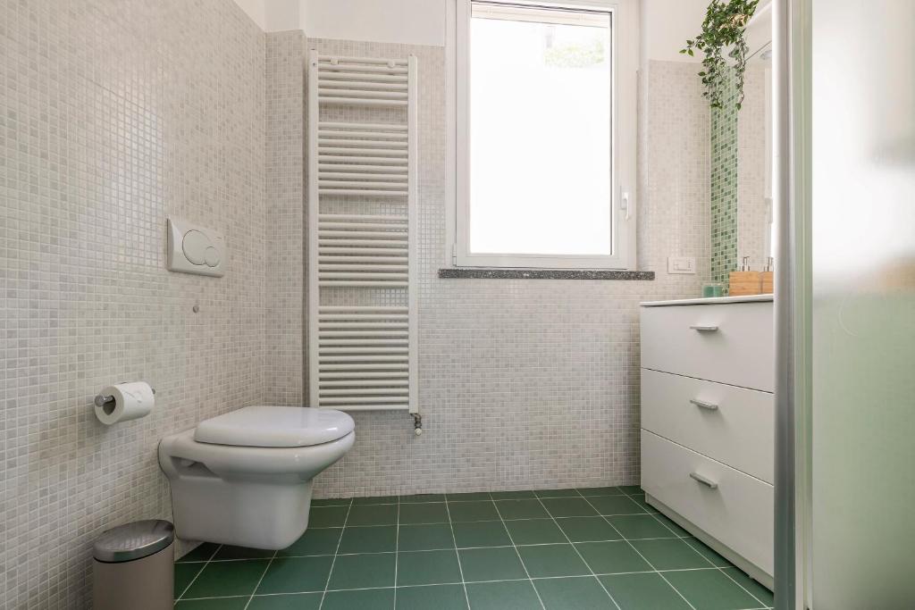 Koupelna v ubytování Appartamento con Terrazzo Vistalago