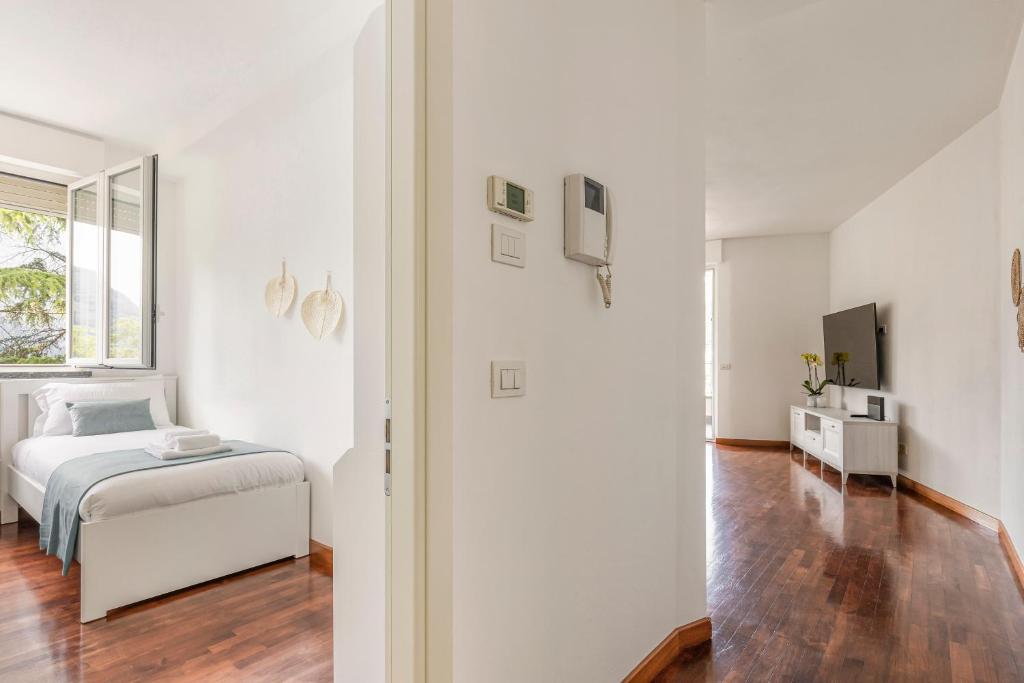 Postel nebo postele na pokoji v ubytování Appartamento con Terrazzo Vistalago