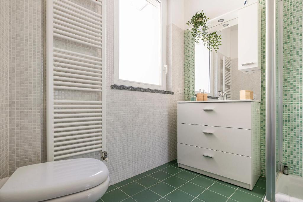 Koupelna v ubytování Appartamento con Terrazzo Vistalago
