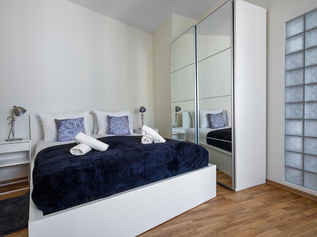 Posteľ alebo postele v izbe v ubytovaní Tyzenhauz Apartments Kazimierz