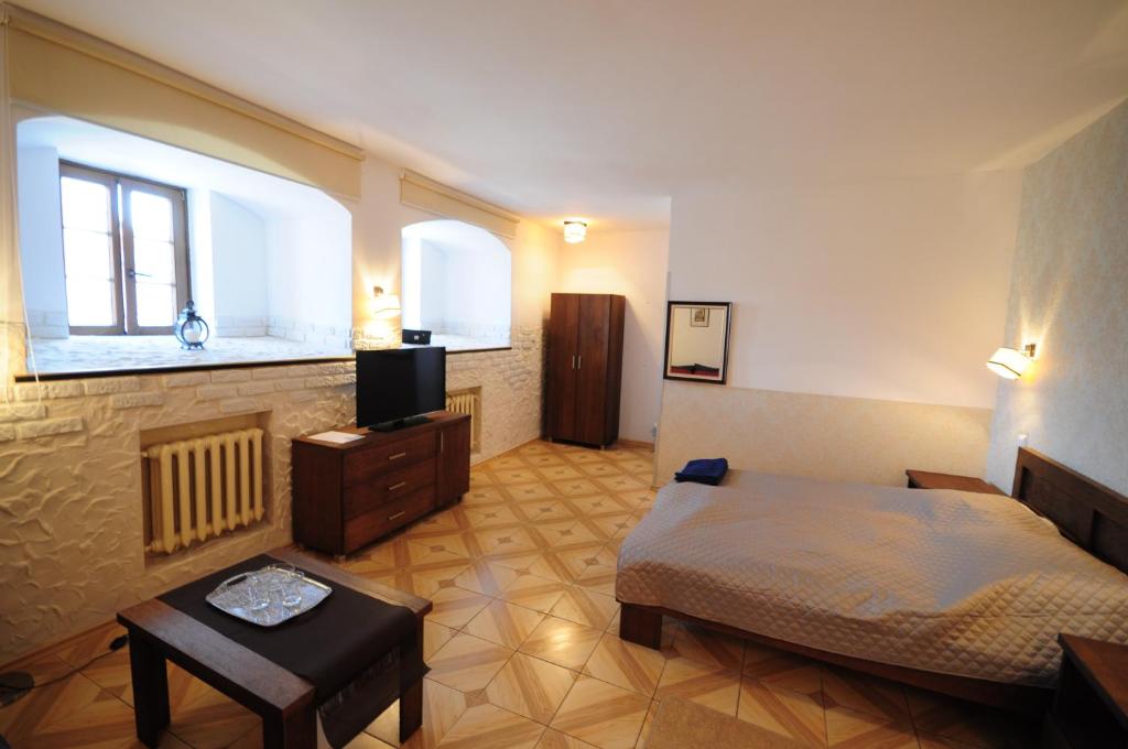 Posteľ alebo postele v izbe v ubytovaní Hotel Wysoka Brama