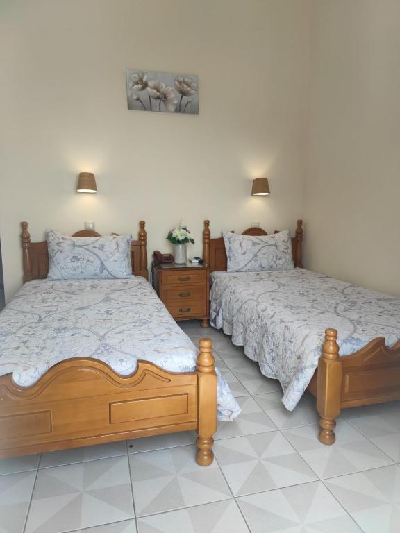 Postel nebo postele na pokoji v ubytování Hotel Anagennisis