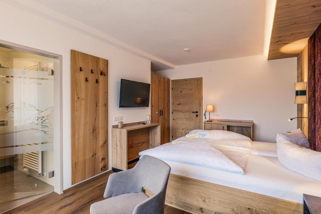 Postel nebo postele na pokoji v ubytování Hotel Föhrenhof