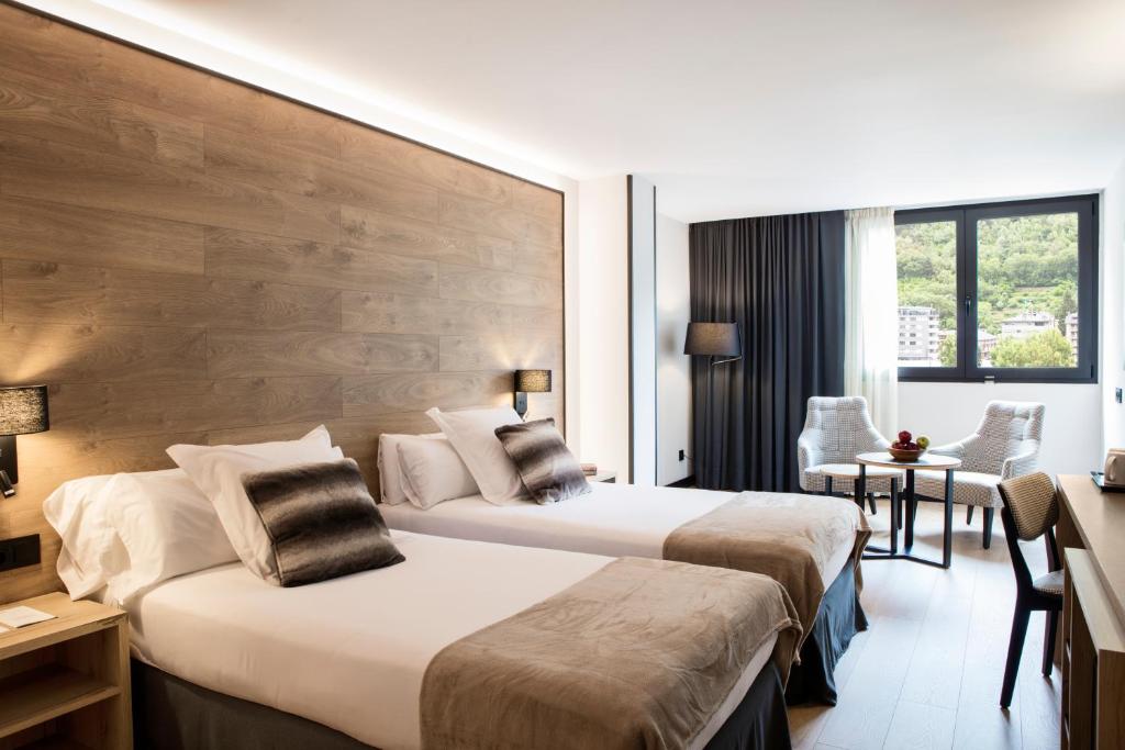 A bed or beds in a room at Acta Arthotel