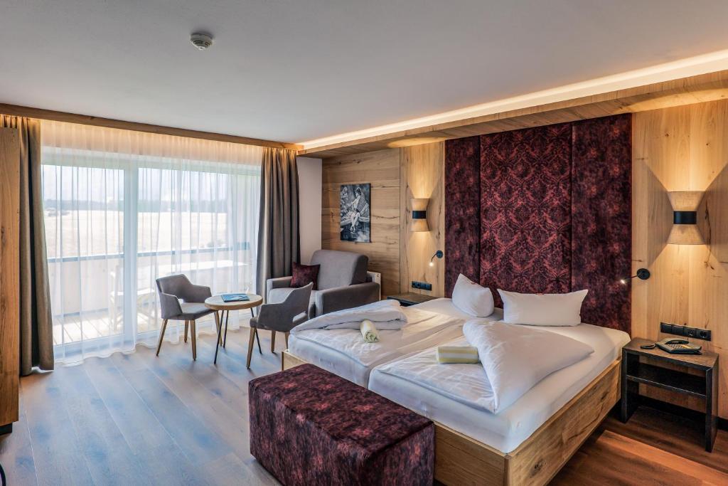 Postel nebo postele na pokoji v ubytování Hotel Föhrenhof
