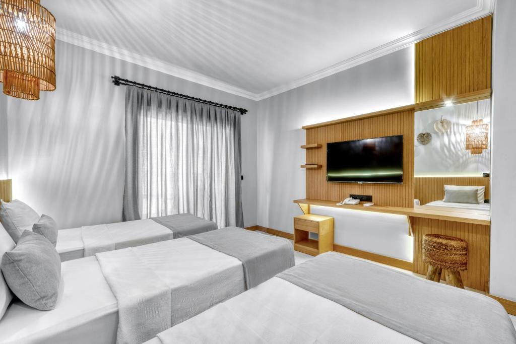 Postel nebo postele na pokoji v ubytování Hildegard Hotel