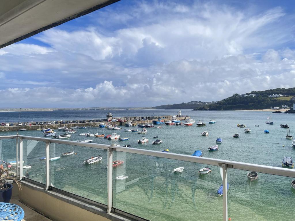 a view of a harbor with boats in the water at Crows Nest - panoramic views of St Ives harbour in St Ives