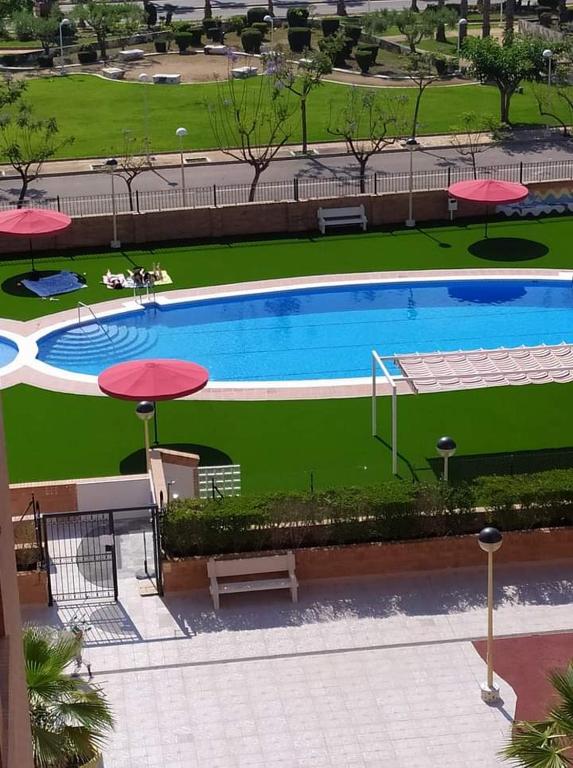 Bazén v ubytovaní Apartamento MAGIC WORLD nueva Marina D`or 2 dormitorios Edificio Torremar alebo v jeho blízkosti