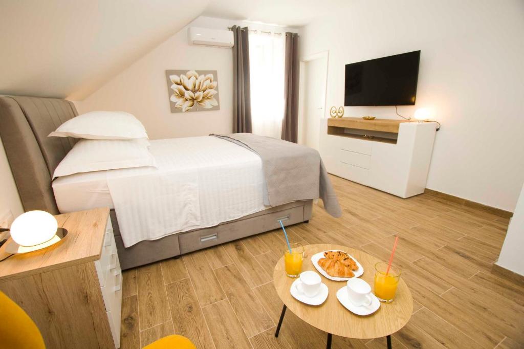 Postel nebo postele na pokoji v ubytování Apartment Navis