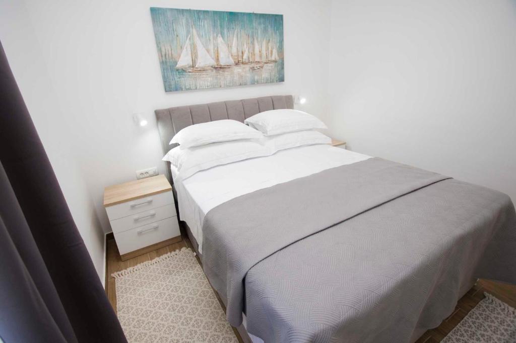 Postel nebo postele na pokoji v ubytování Apartment Navis