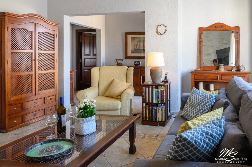 a living room with a couch and a table at Siridaki Homes Leros in Agia Marina