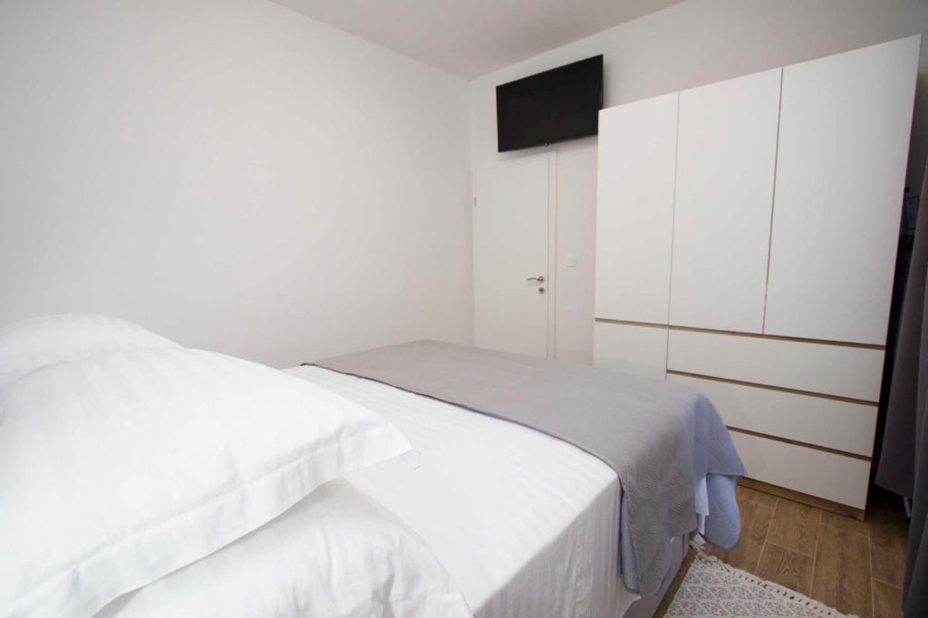 Postel nebo postele na pokoji v ubytování Apartment Navis