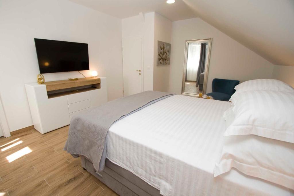 Postel nebo postele na pokoji v ubytování Apartment Navis