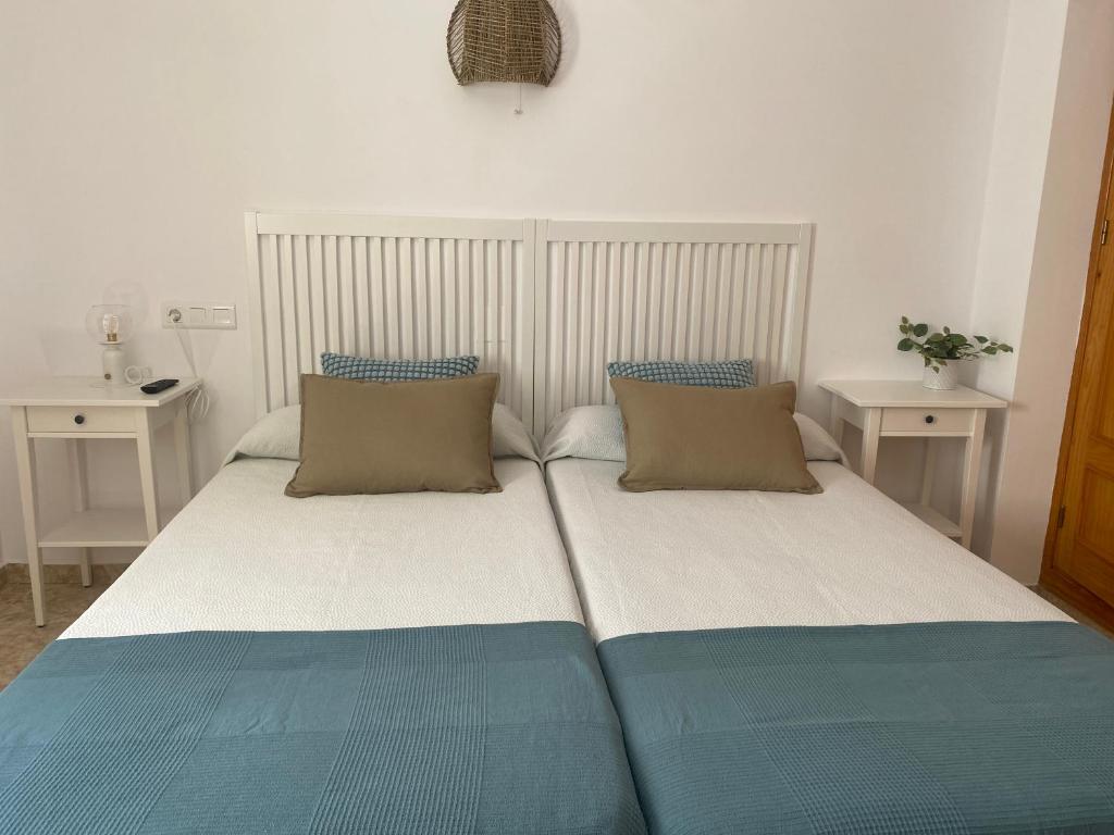 Postel nebo postele na pokoji v ubytování Hostal Andalucia