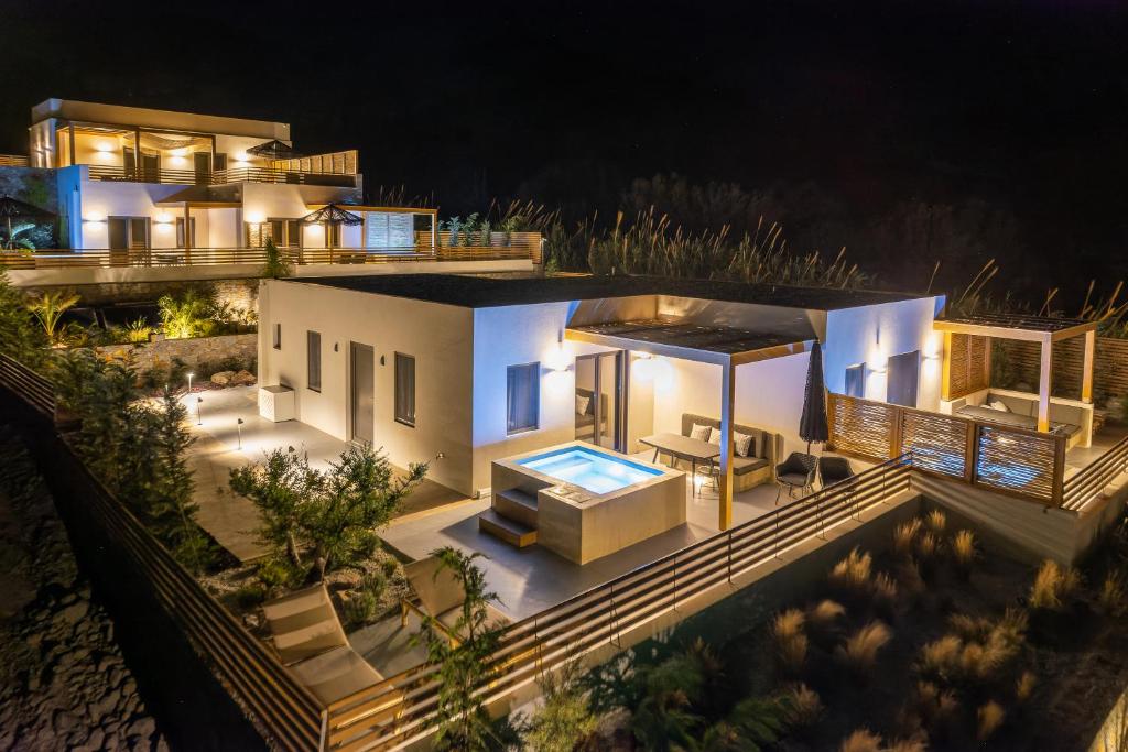 an aerial view of a house at night at Mnḗmē Suites & Villas in Kastrí