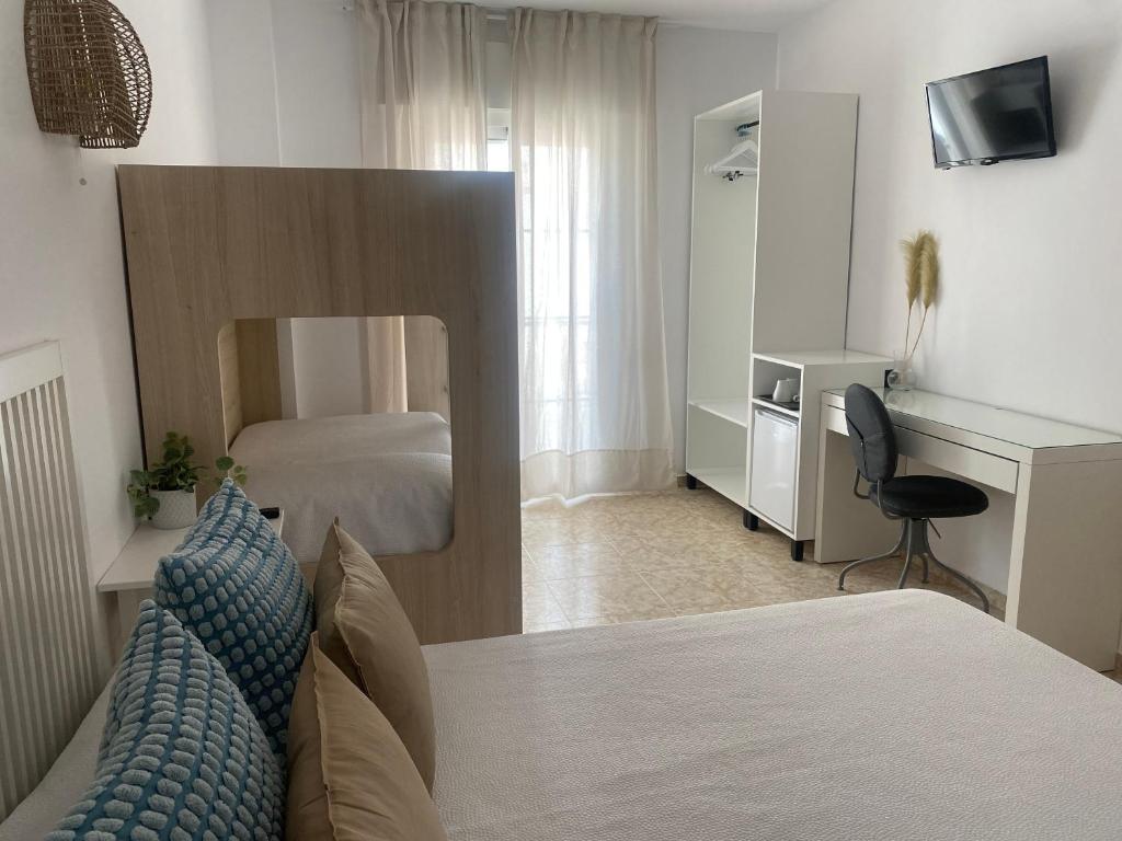 Postel nebo postele na pokoji v ubytování Hostal Andalucia