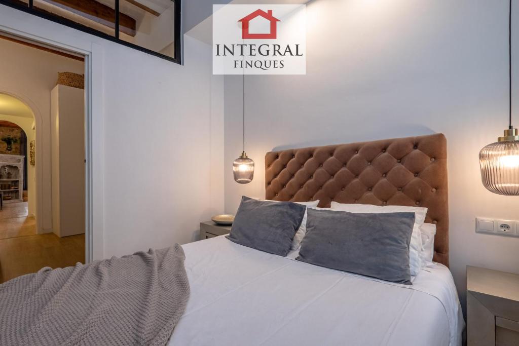Posteľ alebo postele v izbe v ubytovaní Apartaments Ca la Somiada